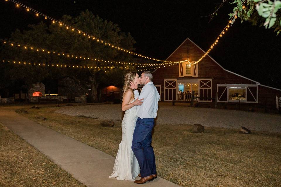 Couple Kissing Under Lights