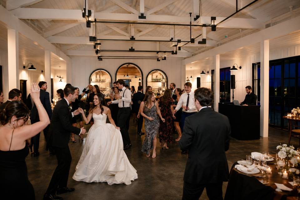 Dance Celebration Under White Trusses.jpg