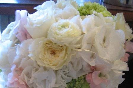 classic bridal bouquet with hydrangea, pale pink sweet pea, ranunculus, cream garden roses and mini green hydrangea