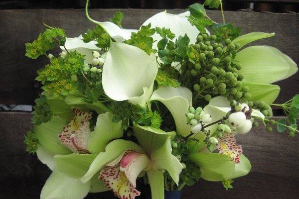white calla lilies, chartreuse cymbidium blooms, snowberry and Brazillia berries