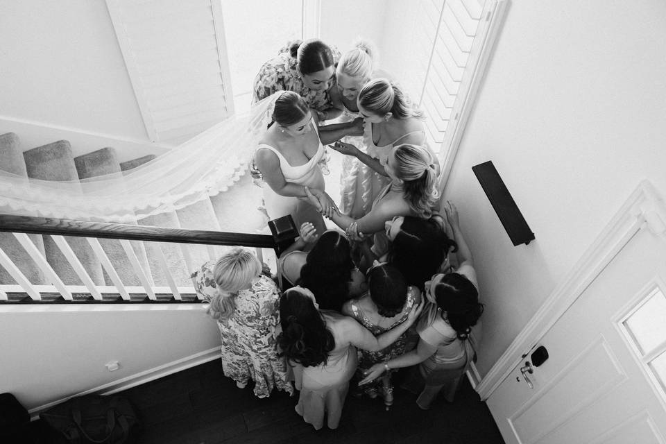 Bride and her girls hug