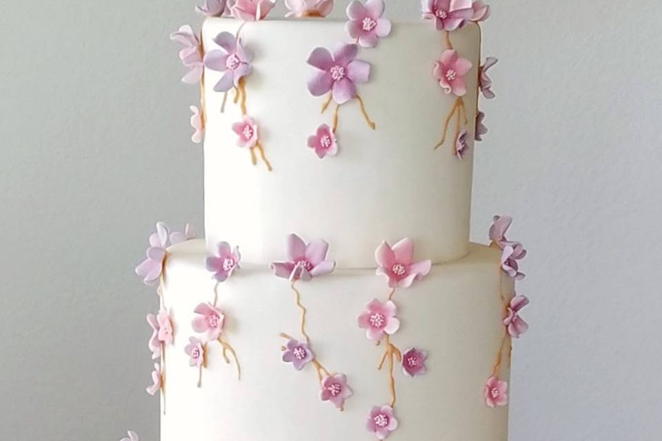 Pink and purple fondant wedding cake by sweet by design in melissa, tx