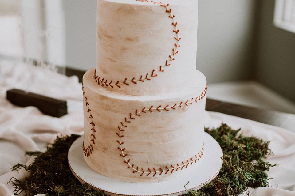 Fondant feather and flower wedding cake