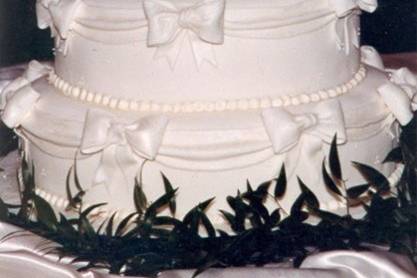 Drapes and Bows fondant Wedding Cake with Handmade Sugar Flowers