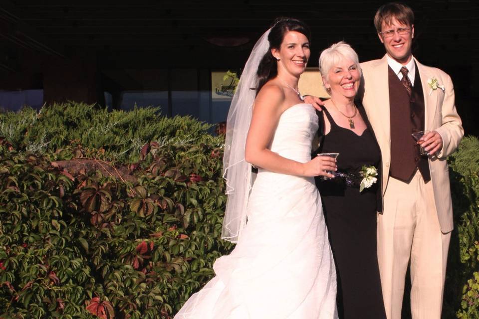 The officiant with the couple