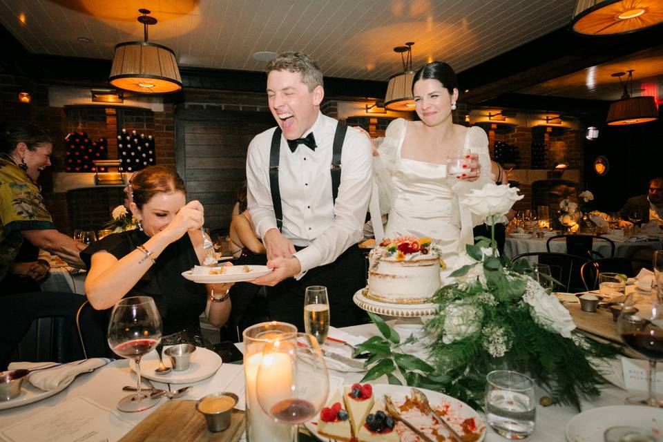 Couple in NYC cutting the cake