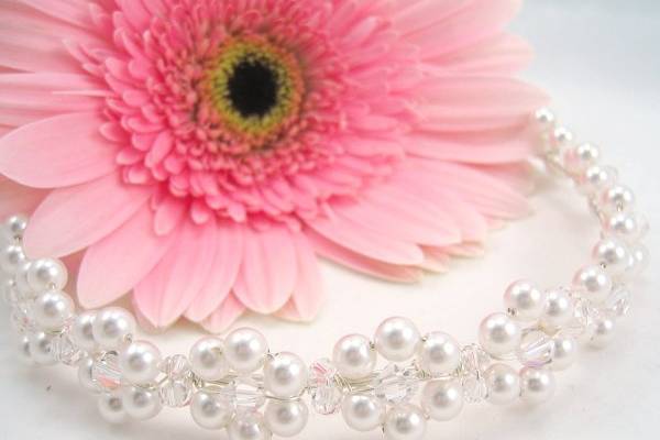 The Daisy tiara. Transitions from a tiara to a choker with the aid of a removable extension. No restringing necessary. Available in multiple colors.