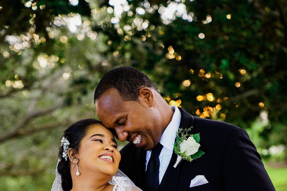 Newlyweds by the car