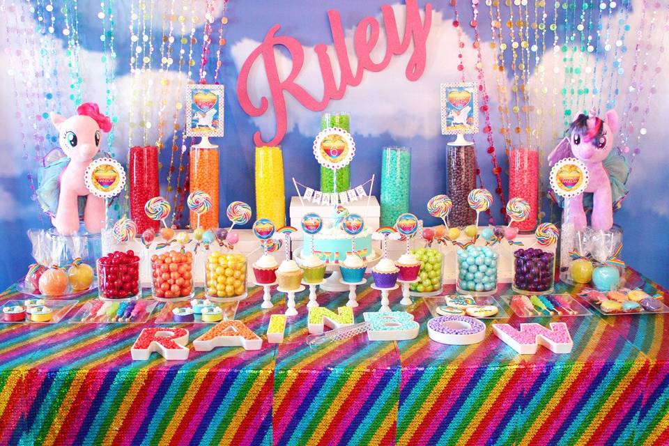 This is an example of the variety of candy we provide and could provide you for a candy buffet at your wedding or event.
Sweet City Candy provided the candy for this amazing Rainbow themed birthday party. It included jelly beans, gum balls, Sixlets, Whirly pops, and Rock Candy.