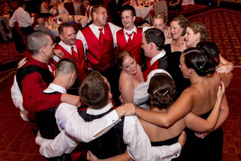 Bridesmaids and groomsmen around the newlyweds