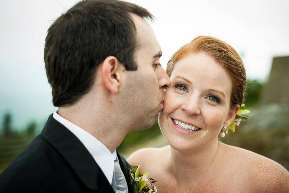 Groom kisses his bride