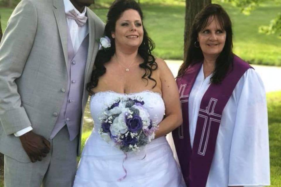 The couple with the officiant