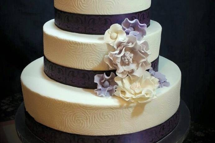 This beautiful Wedding Cake was in colors of Eggplant, purples and whites