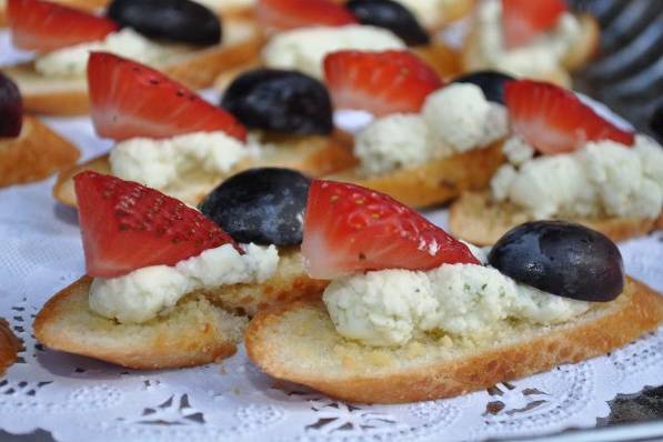 Butler Pass Hors D'oeuvreBoursin Cheese on a Toasted Crostini and topped with Fresh Strawberries & Grape
