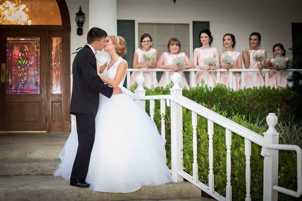 Couple posing against column