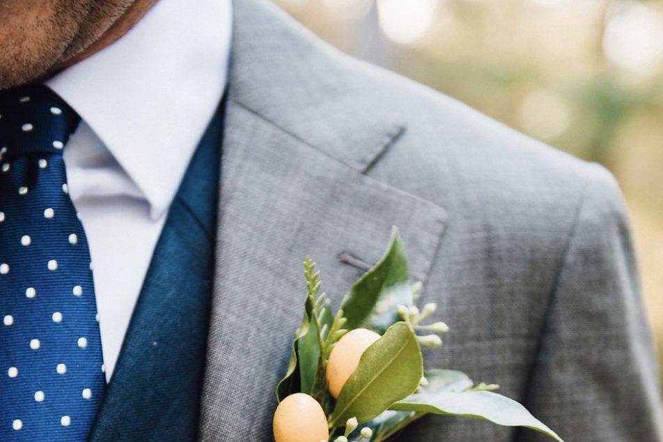 Three-piece suit and boutonniere