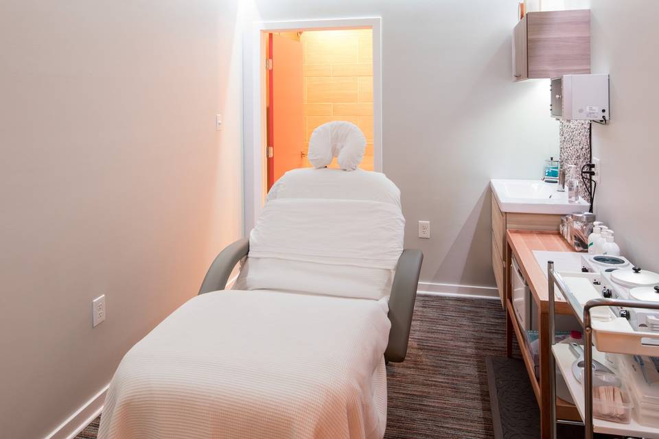 Treatment room with full attached bathroom including steam shower