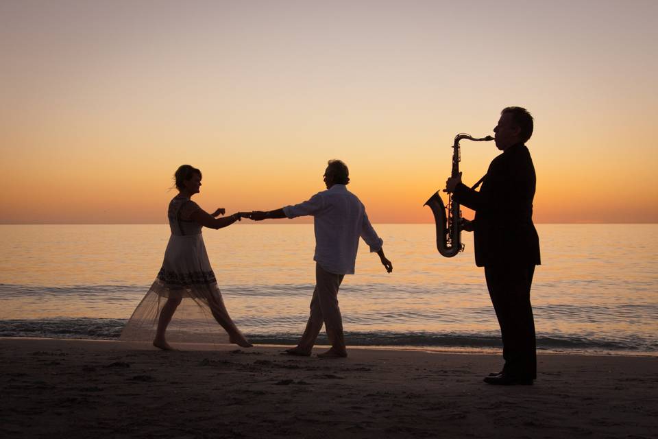 Couple dance on the beach after their intimate wedding ceremony on Captiva Island