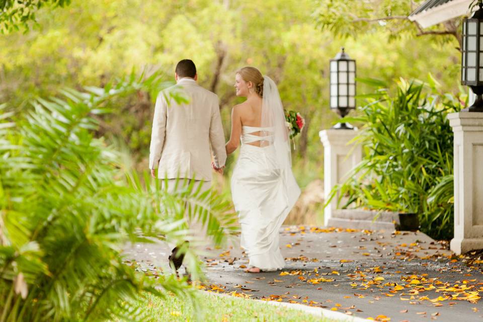 couple enjoy romantic walk after their beach ceremony at the Casa Ybel Resort on Sanibel Island