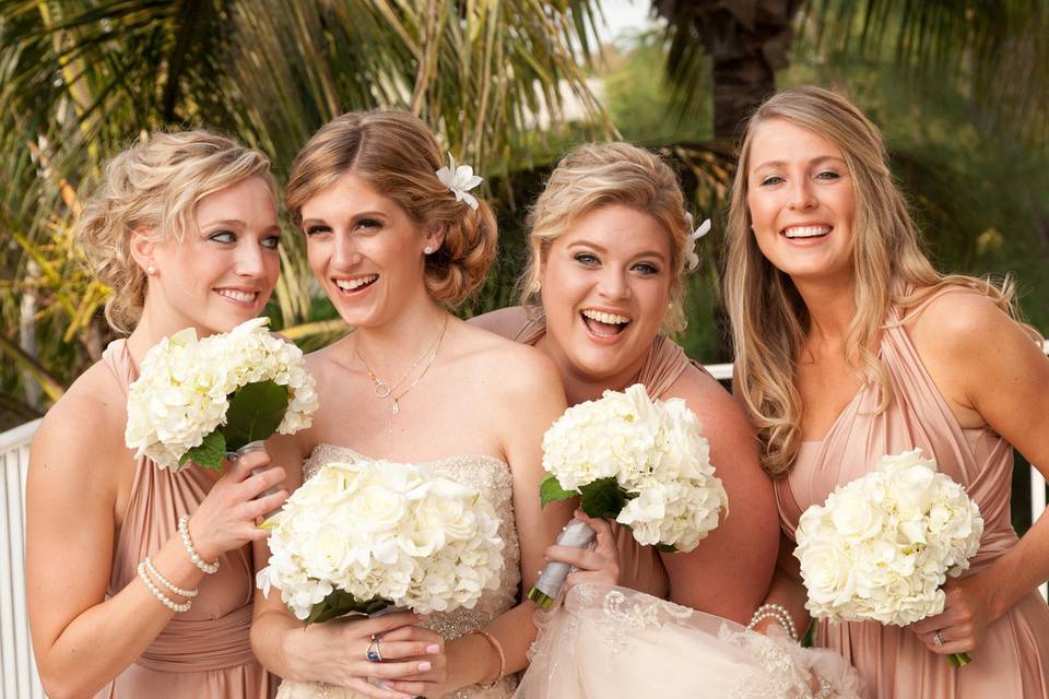 bride enjoys a few moments of joy with her bridesmaids before the wedding ceremony on Captiva Island