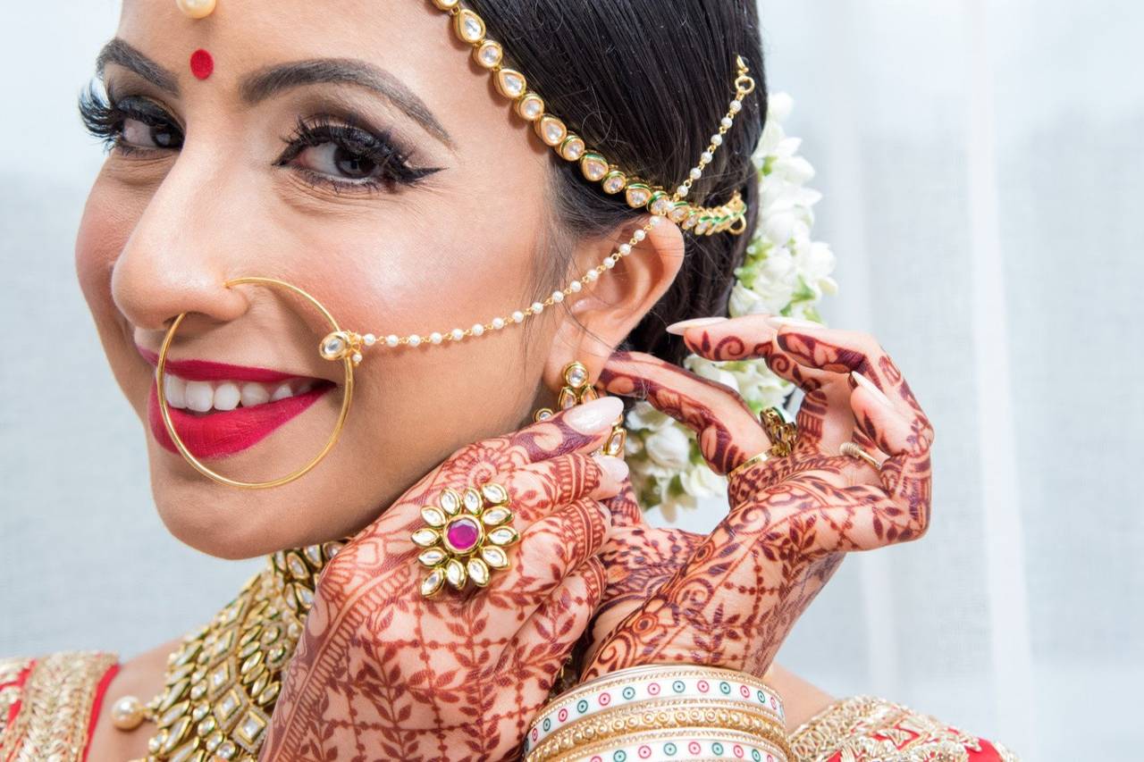 Beautiful Bengali Bride in Red and Gold Outfit