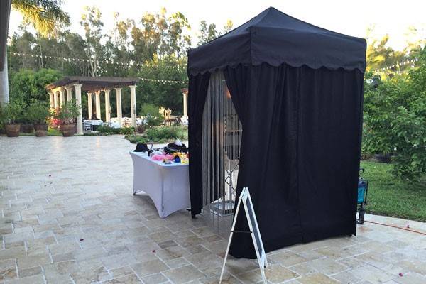 Outdoor photo booth and props table - Lucky Photo Booth