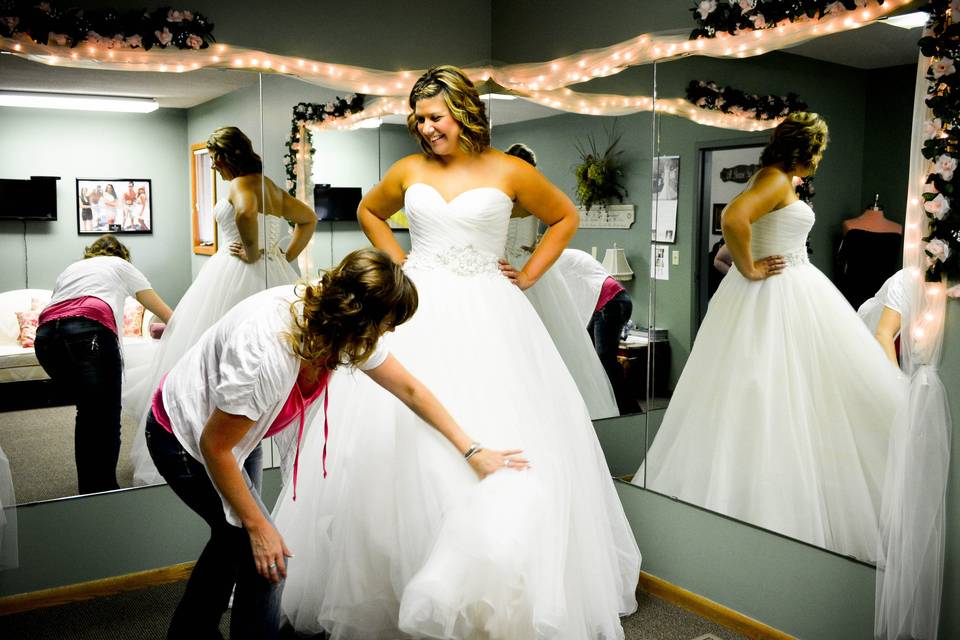 Bride trying on her dress