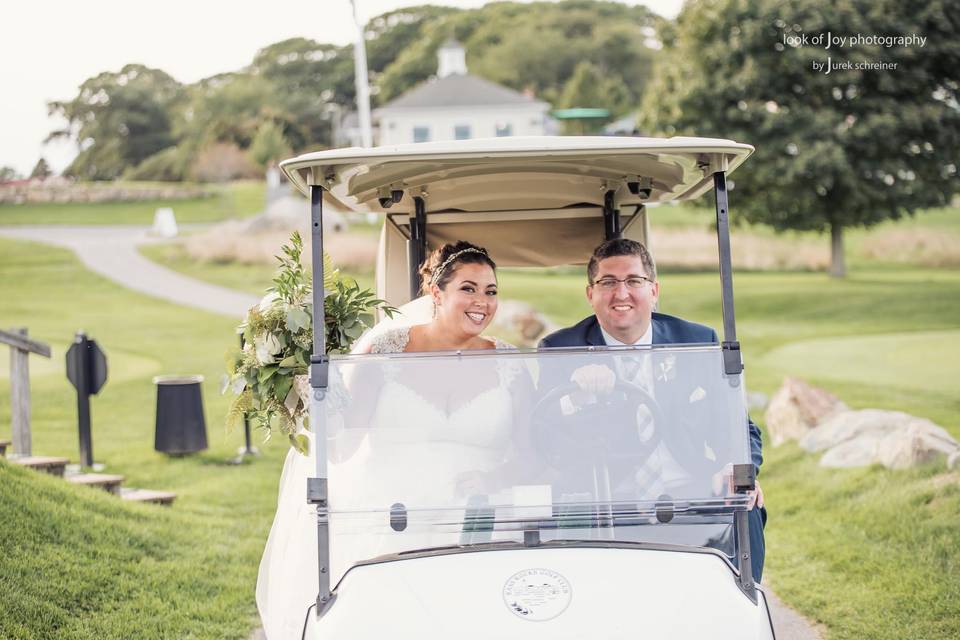 Newlyweds on a golf cart | Credit Look of Joy Photography