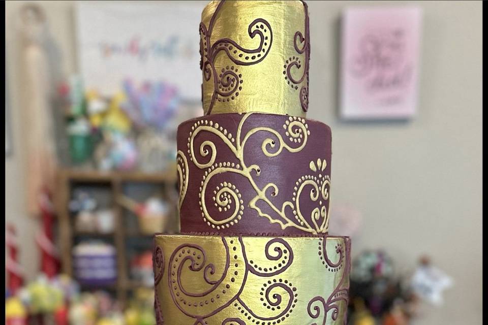 Gold and maroon fake cake