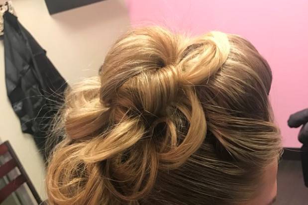Curled pinned back hairdo