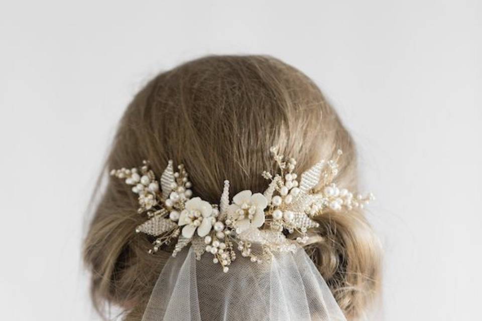 Bridal veil pinned and decorated with flowers