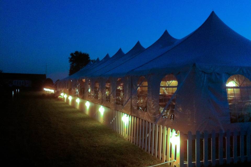 Long tent lit up at night
