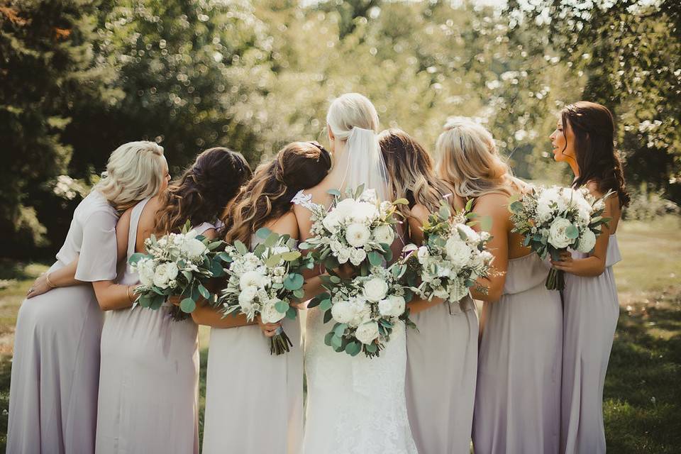 Bride and her bridesmaids with their bouquets