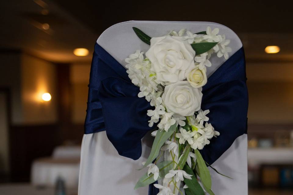 White aisle floral arrangement