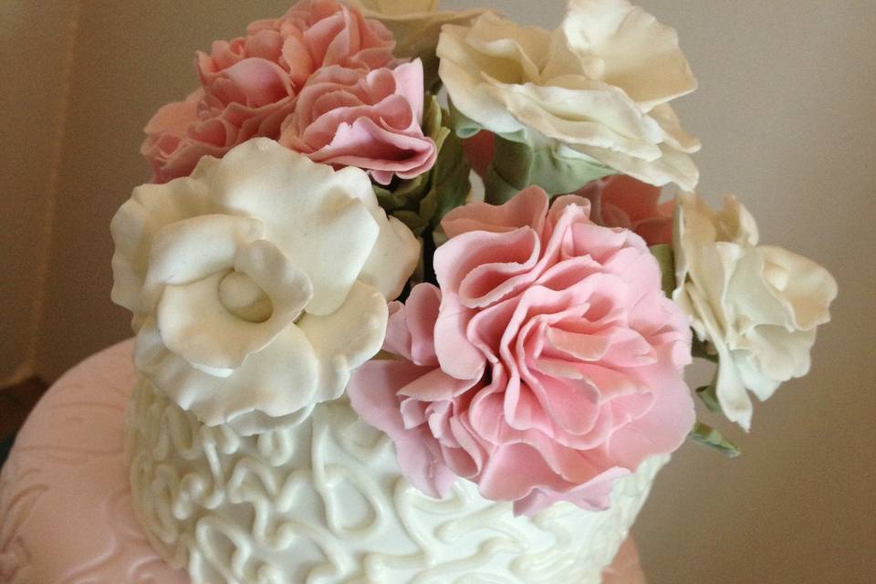 Pale Pink, light pink, sugar paste carnations, sugar paste roses, 3 tier, impression mat, cornelli piping.
