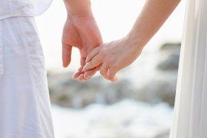Two people dressed in white ho