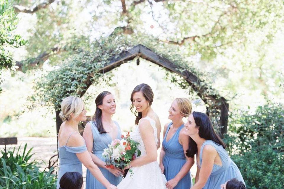 Bridal party by archway