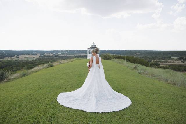 Bride on lawn near gazebo