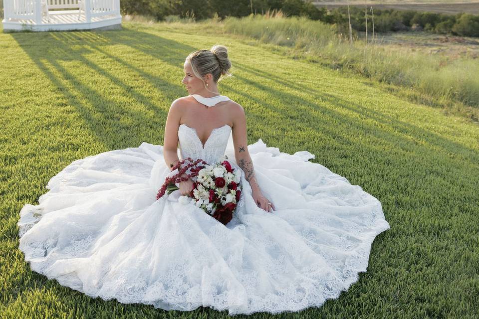 Bride on lawn near gazebo
