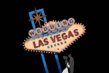 Bride & Groom standing near Las Vegas Sign