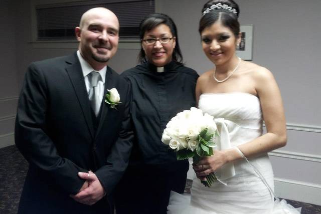 The couple and the wedding officiant