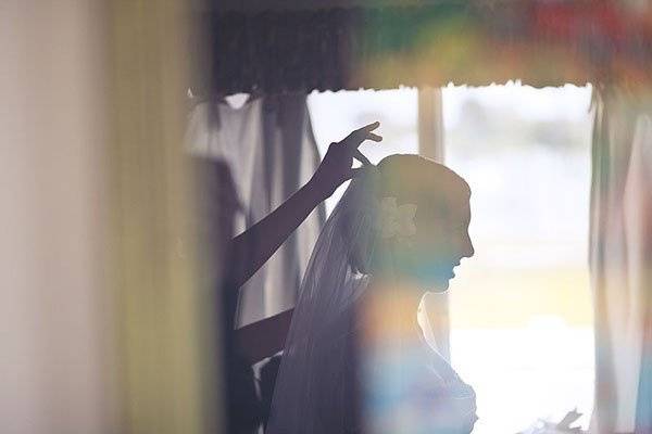 Reflection of Bride in window