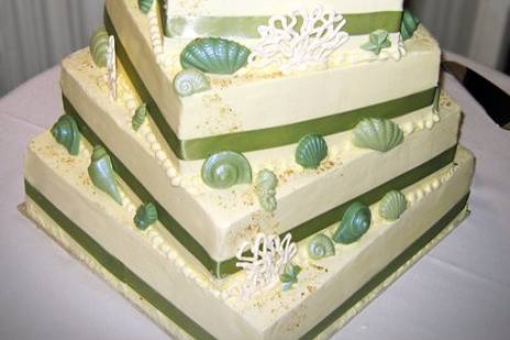 Beach-themed cake with chocolate seashells and hand-made coral