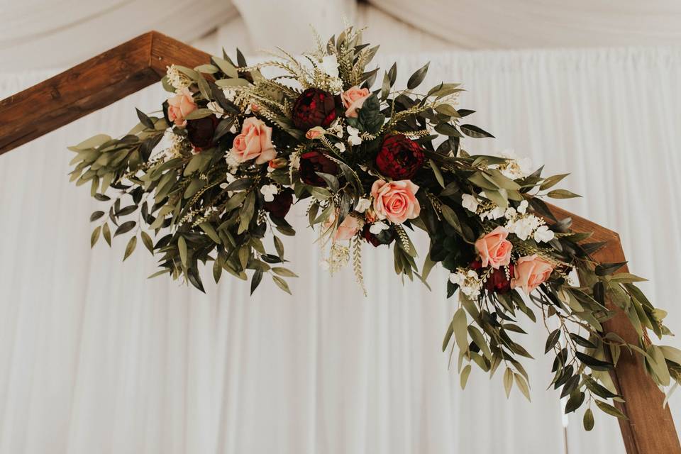 Burgundy and greenery arch