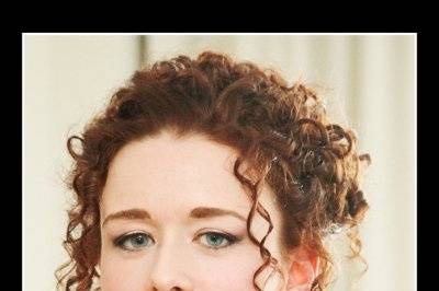Wedding Tresses bridal updo on a curly red head. Bridal makeup style is natural.
