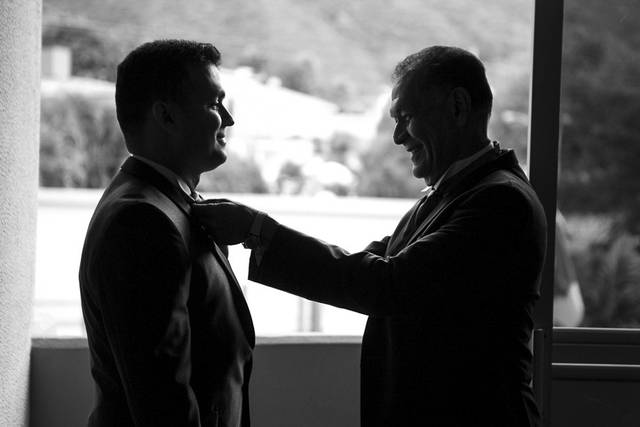 Groom and father finishing the last details