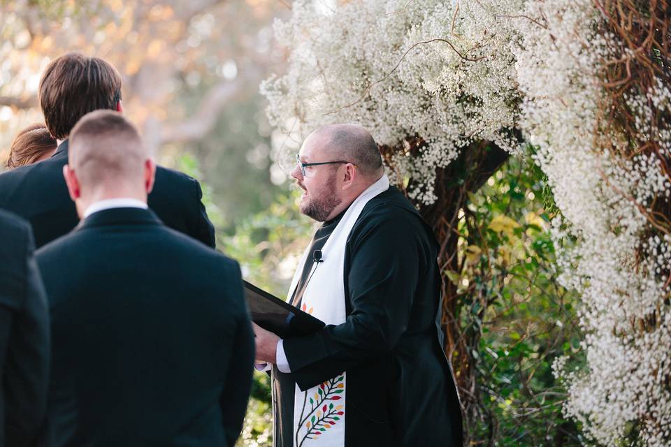 Cam watching his happy couple ring the wedding bell at Chapel Dulcinea