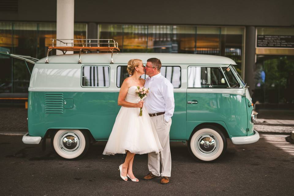 Quick kiss between the happy couple