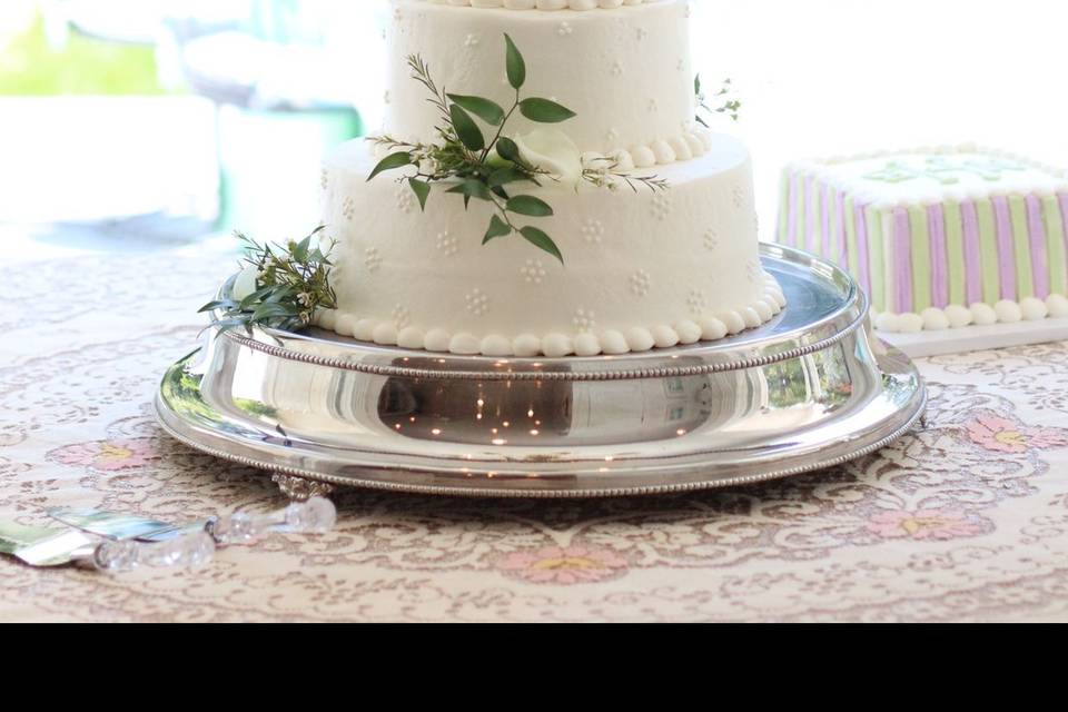 Traditional cake under elegant chandelier