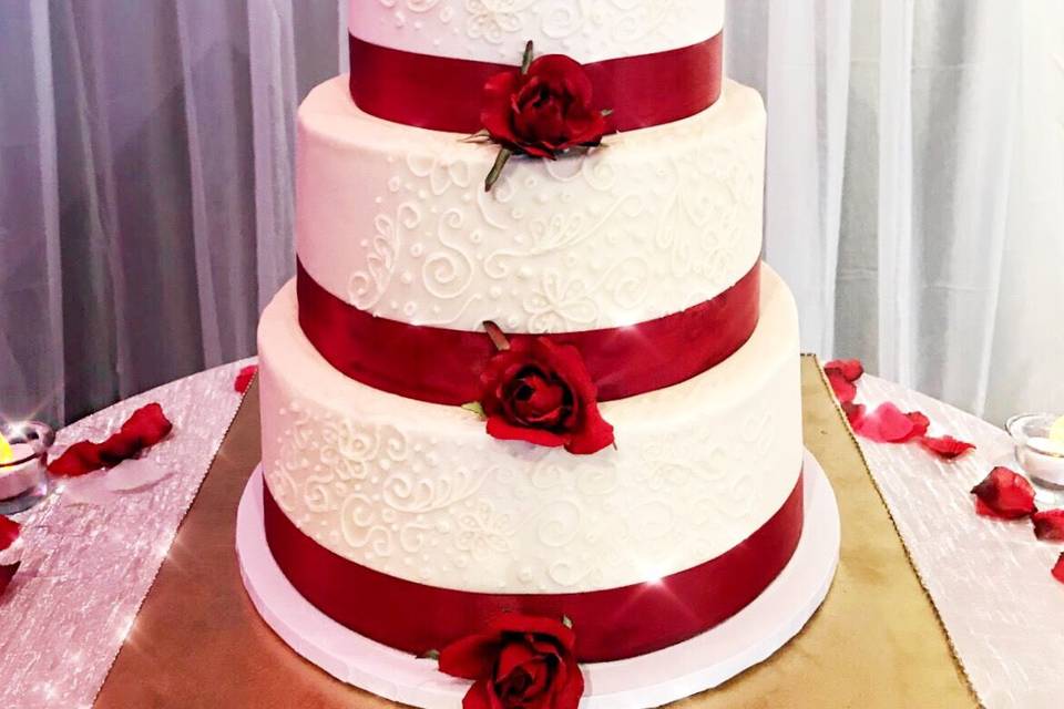 Wedding cake with red ribbons